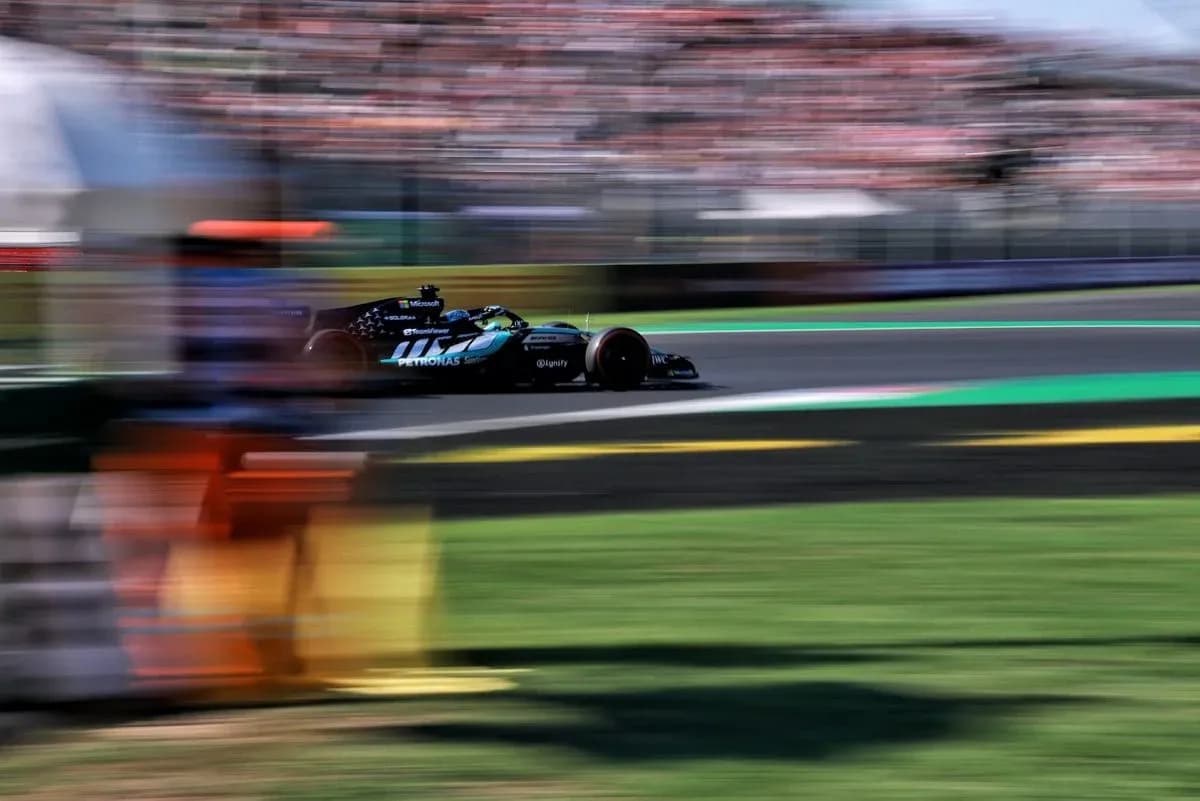 Formula 1 car racing on track during event Formula 1 car racing on track during event