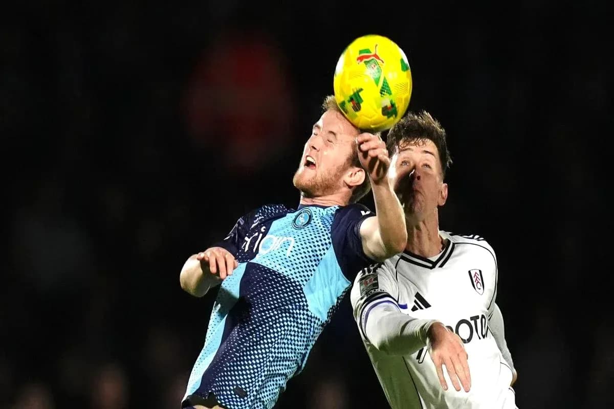 Two players challenging for the ball during match Two players challenging for the ball during match