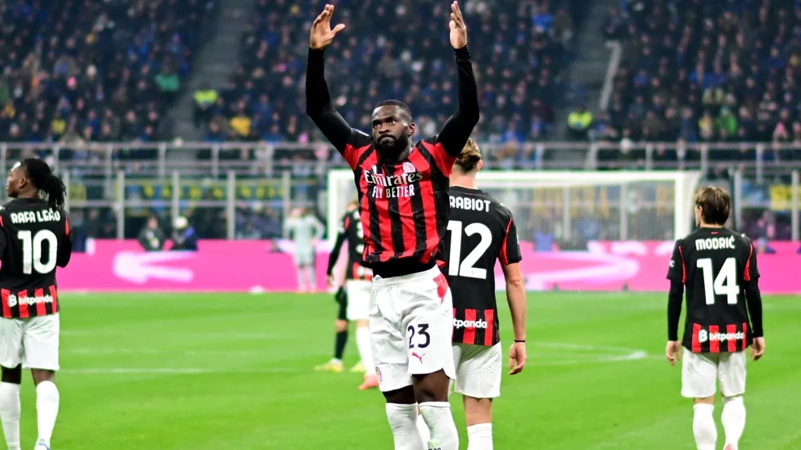 AC Milan players celebrating during a match AC Milan players celebrating during a match
