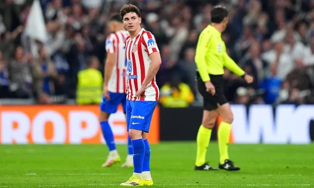 Atlético Madrid player looking concerned on the field Atlético Madrid player looking concerned on the field