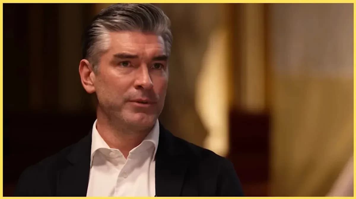 Man speaking during an interview in formal setting Man speaking during an interview in formal setting