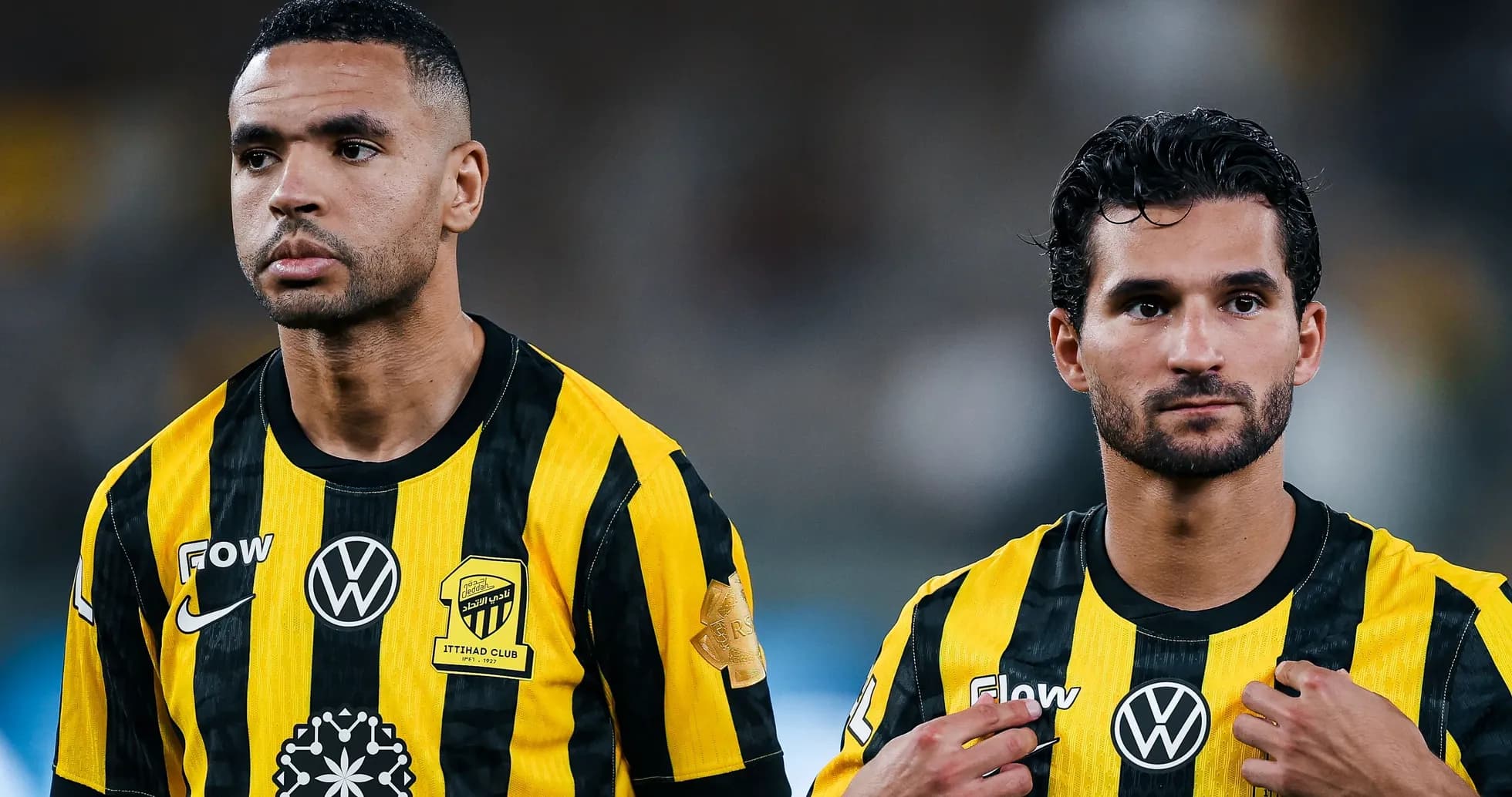 Ittihad Club players in yellow and black jerseys Ittihad Club players in yellow and black jerseys