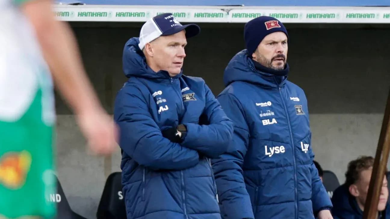 Two coaches observing the match from the sidelines Two coaches observing the match from the sidelines