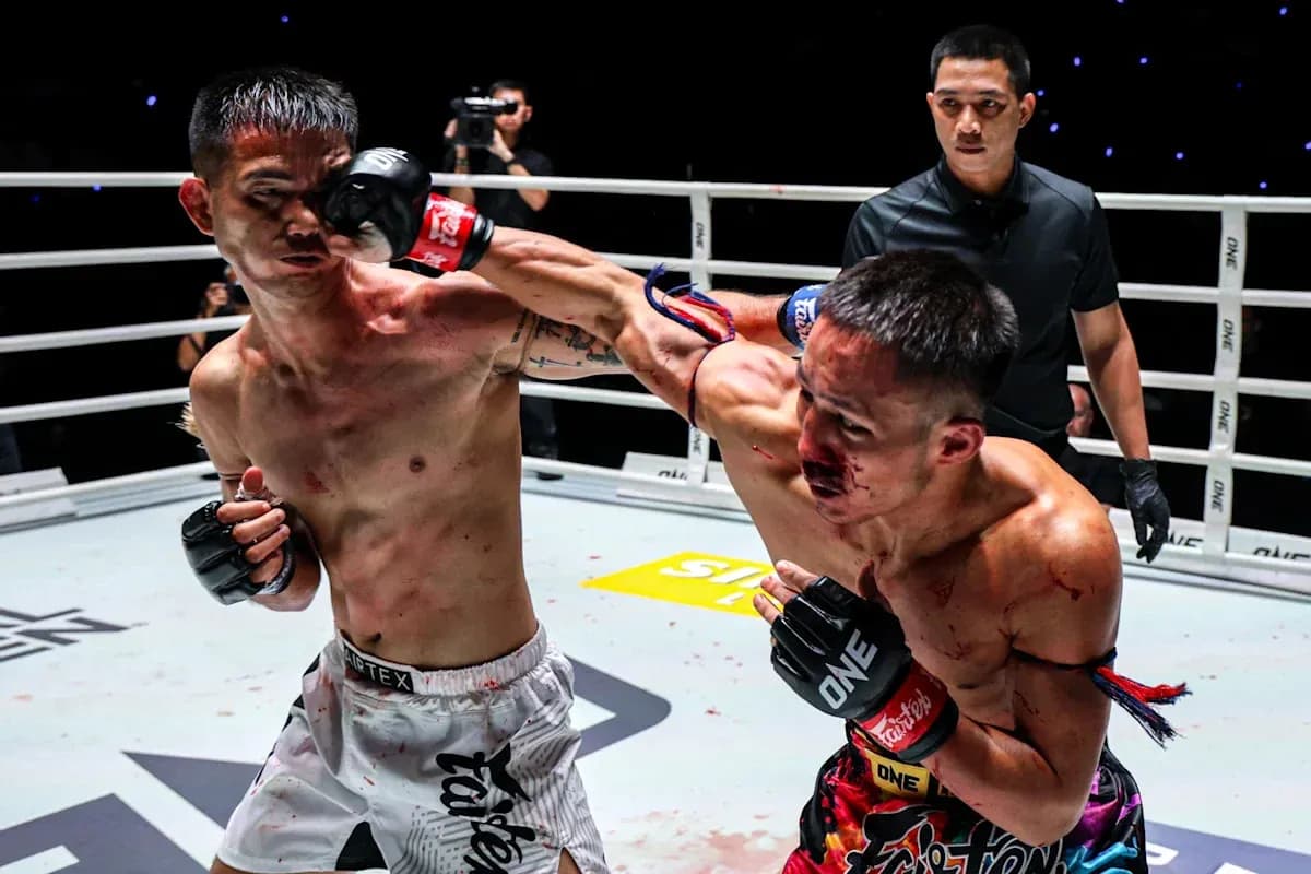 Two fighters exchanging punches in boxing ring Two fighters exchanging punches in boxing ring