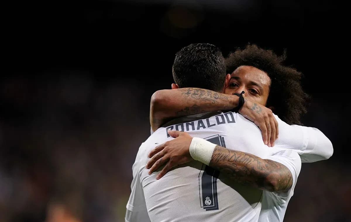 Cristiano Ronaldo and Marcelo hugging on the field Cristiano Ronaldo and Marcelo hugging on the field