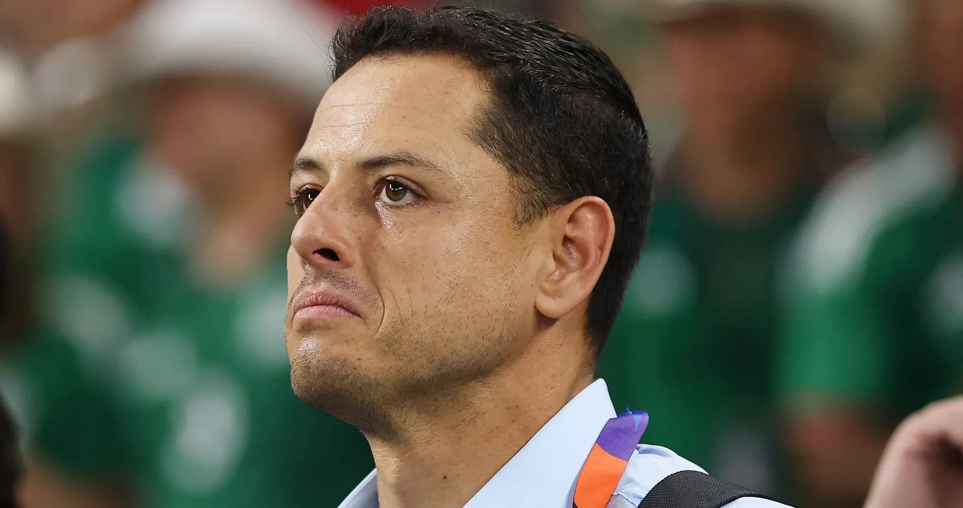 Man with tearful expression during an event Man with tearful expression during an event