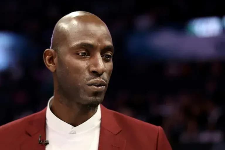 Basketball player speaking during an event Basketball player speaking during an event