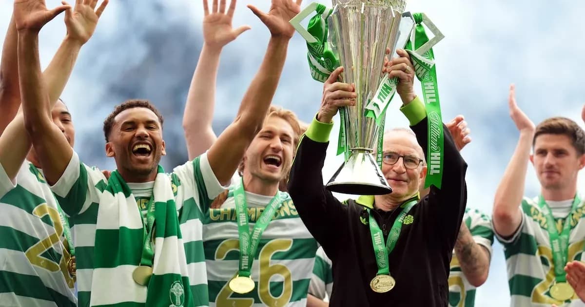 Celtic players celebrating with championship trophy Celtic players celebrating with championship trophy