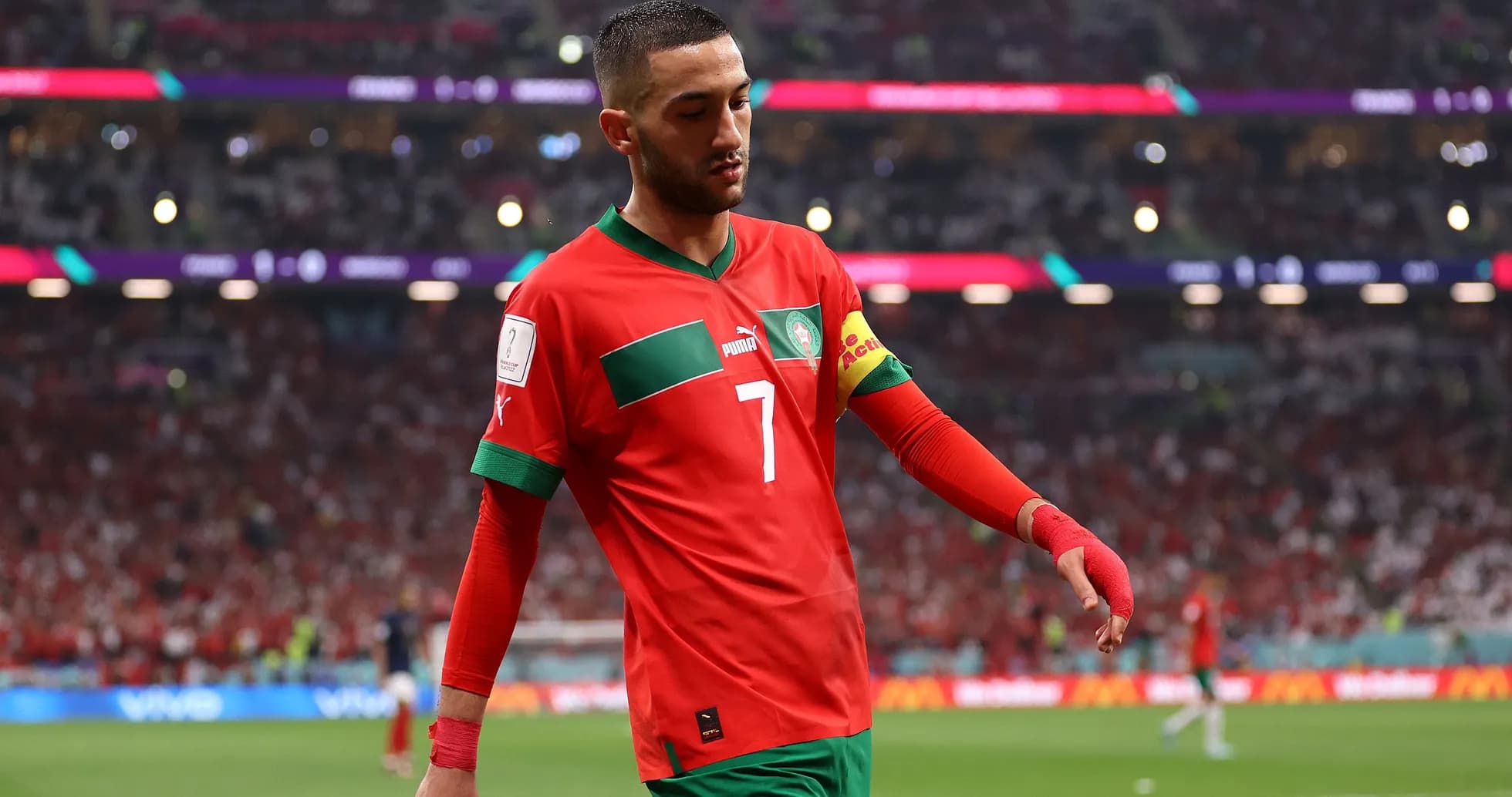 Hakam Ziyech walking on the pitch in red jersey Hakam Ziyech walking on the pitch in red jersey