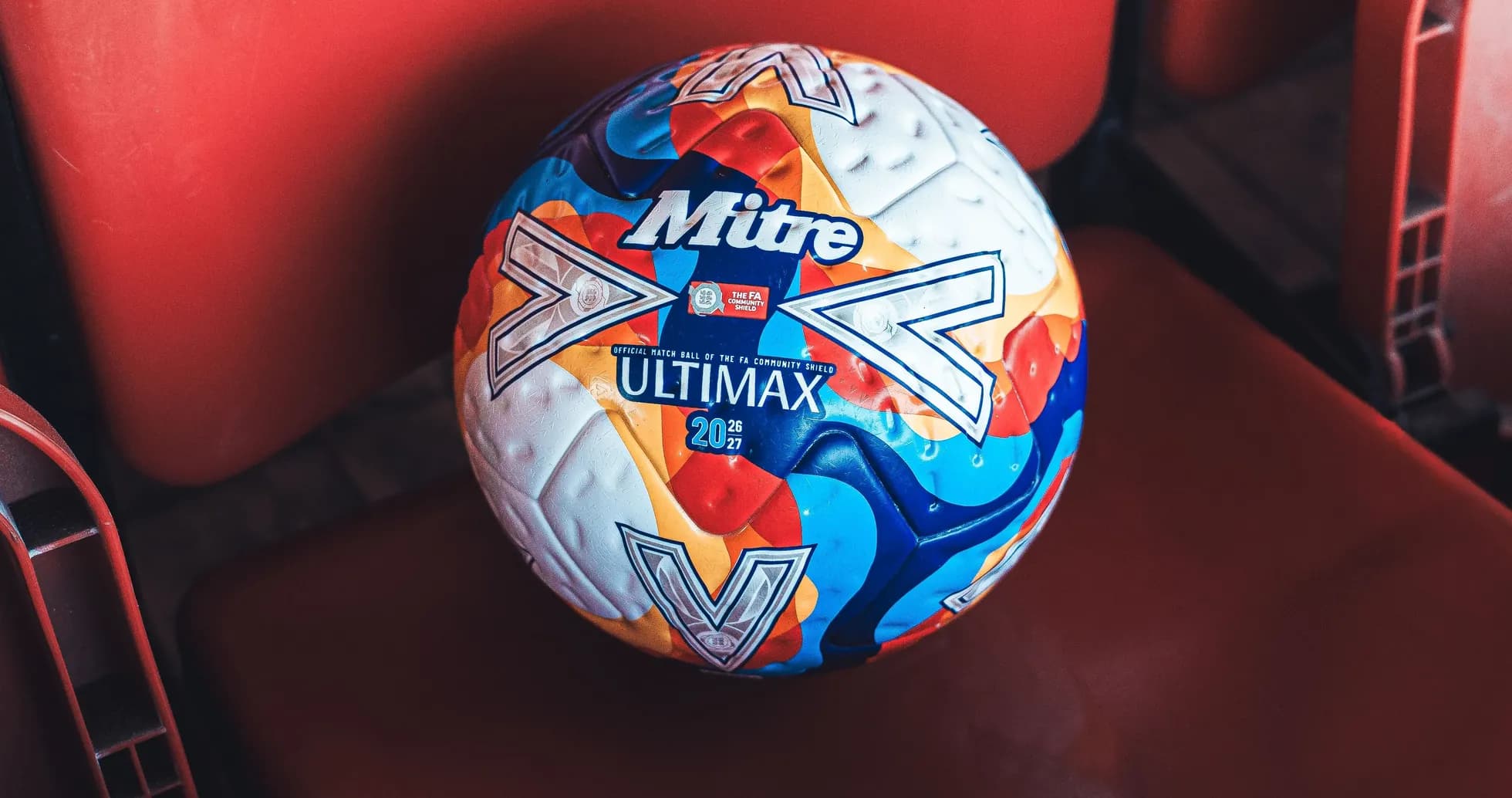 Mitre Ultimax match ball on stadium seat Mitre Ultimax match ball on stadium seat