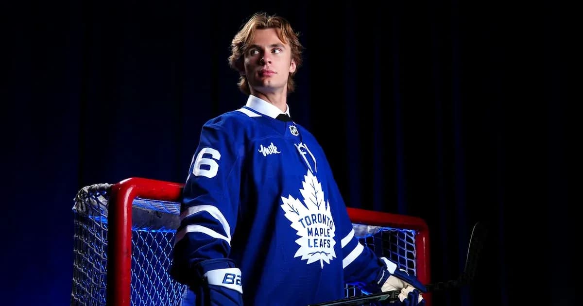 Hockey player in Toronto Maple Leafs jersey posing Hockey player in Toronto Maple Leafs jersey posing