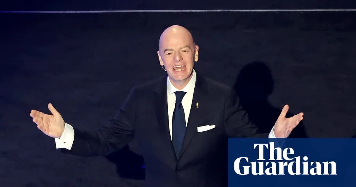 FIFA president speaking at an event with arms raised FIFA president speaking at an event with arms raised