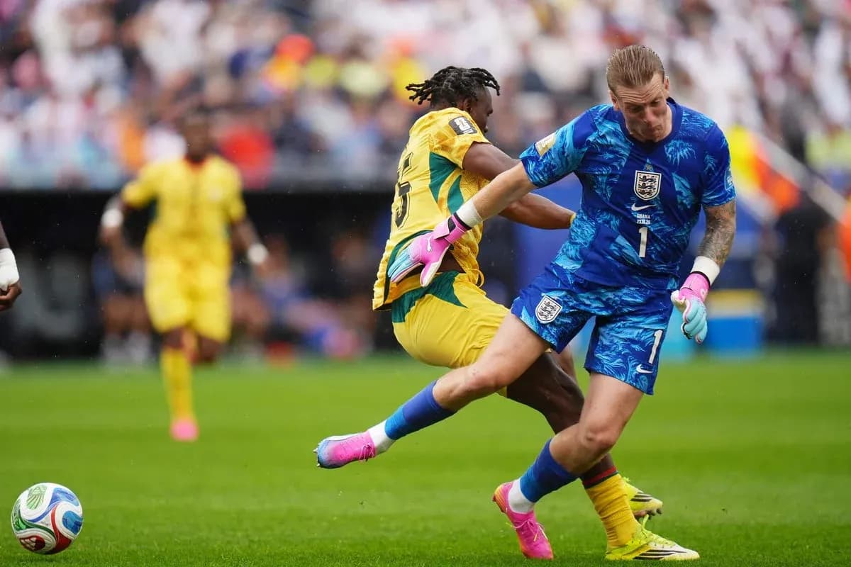 Goalkeeper colliding with an opposing player during match Goalkeeper colliding with an opposing player during match