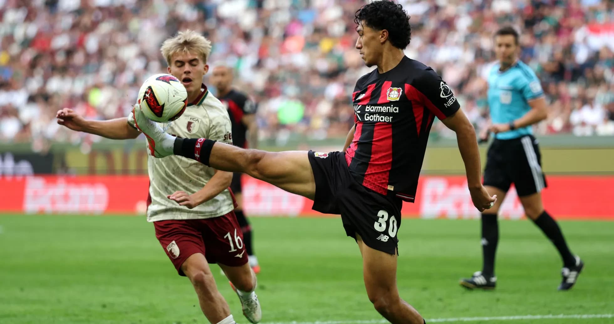Bayer Leverkusen player kicking ball during match Bayer Leverkusen player kicking ball during match