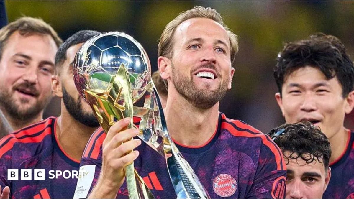 Player celebrating with trophy after winning match Player celebrating with trophy after winning match