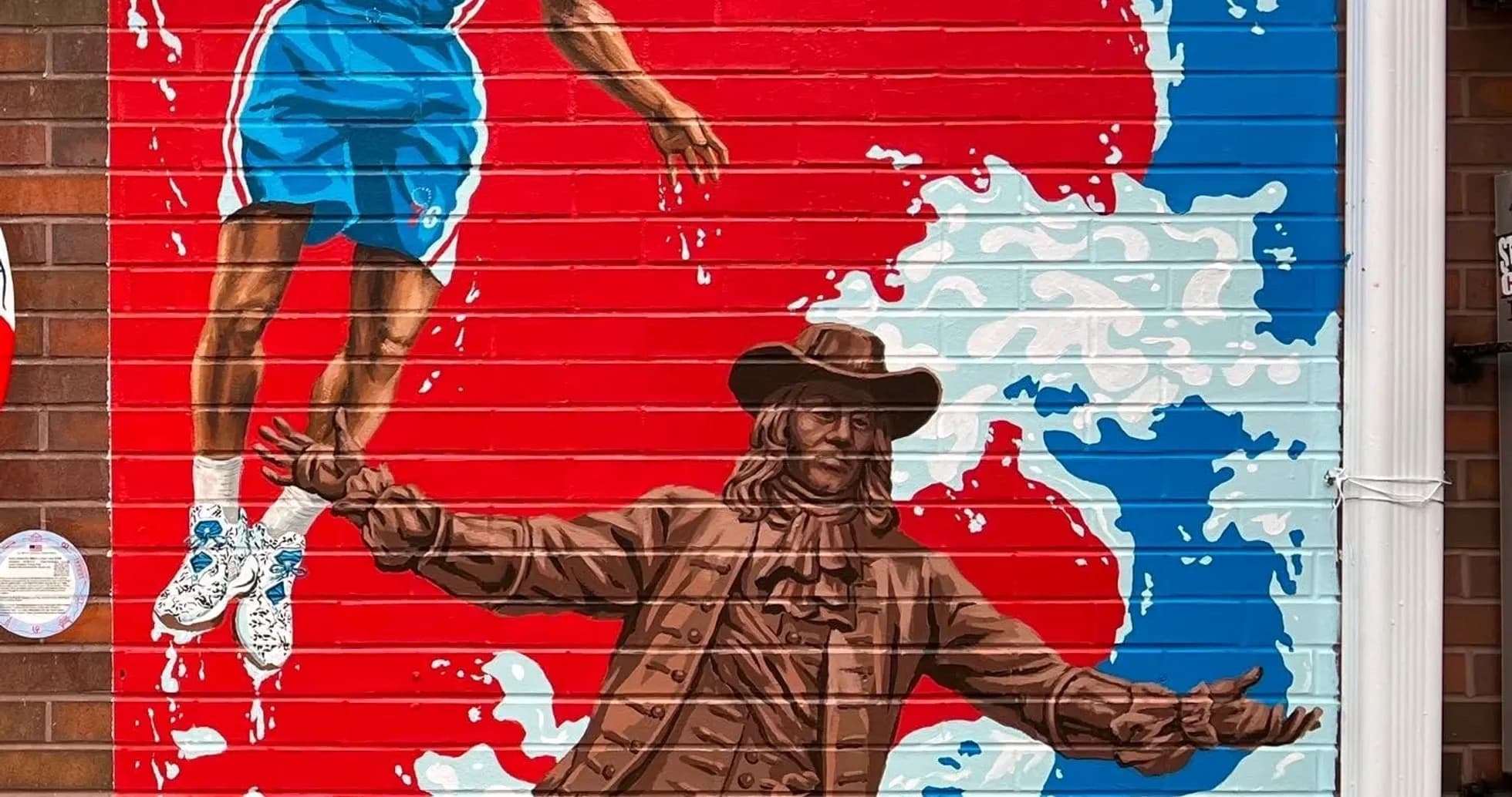 Mural of basketball player and historical figure Mural of basketball player and historical figure