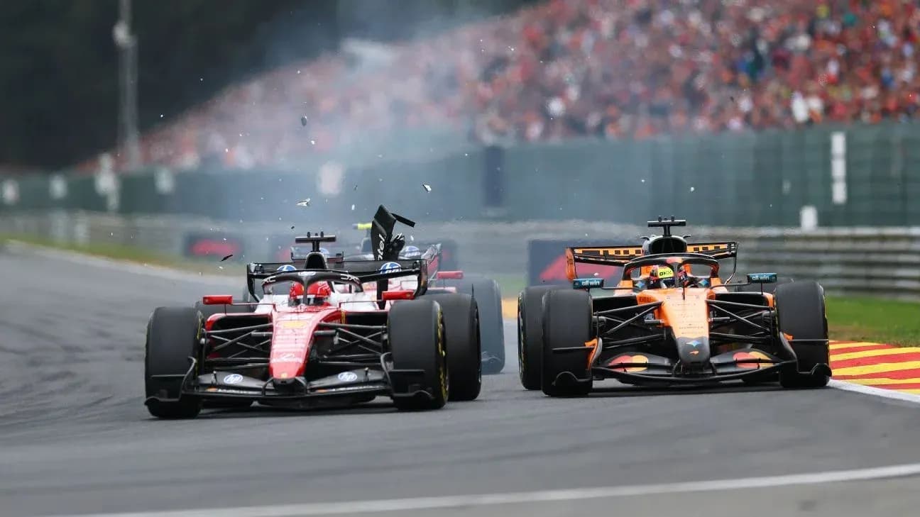 Two Formula 1 cars colliding on the track Two Formula 1 cars colliding on the track