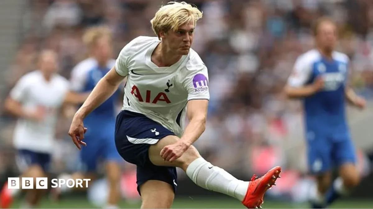 Tottenham player kicking ball during match action Tottenham player kicking ball during match action