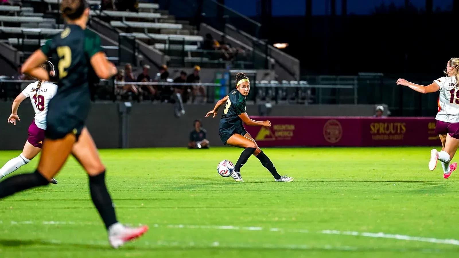 Player passing the ball during a soccer match Player passing the ball during a soccer match