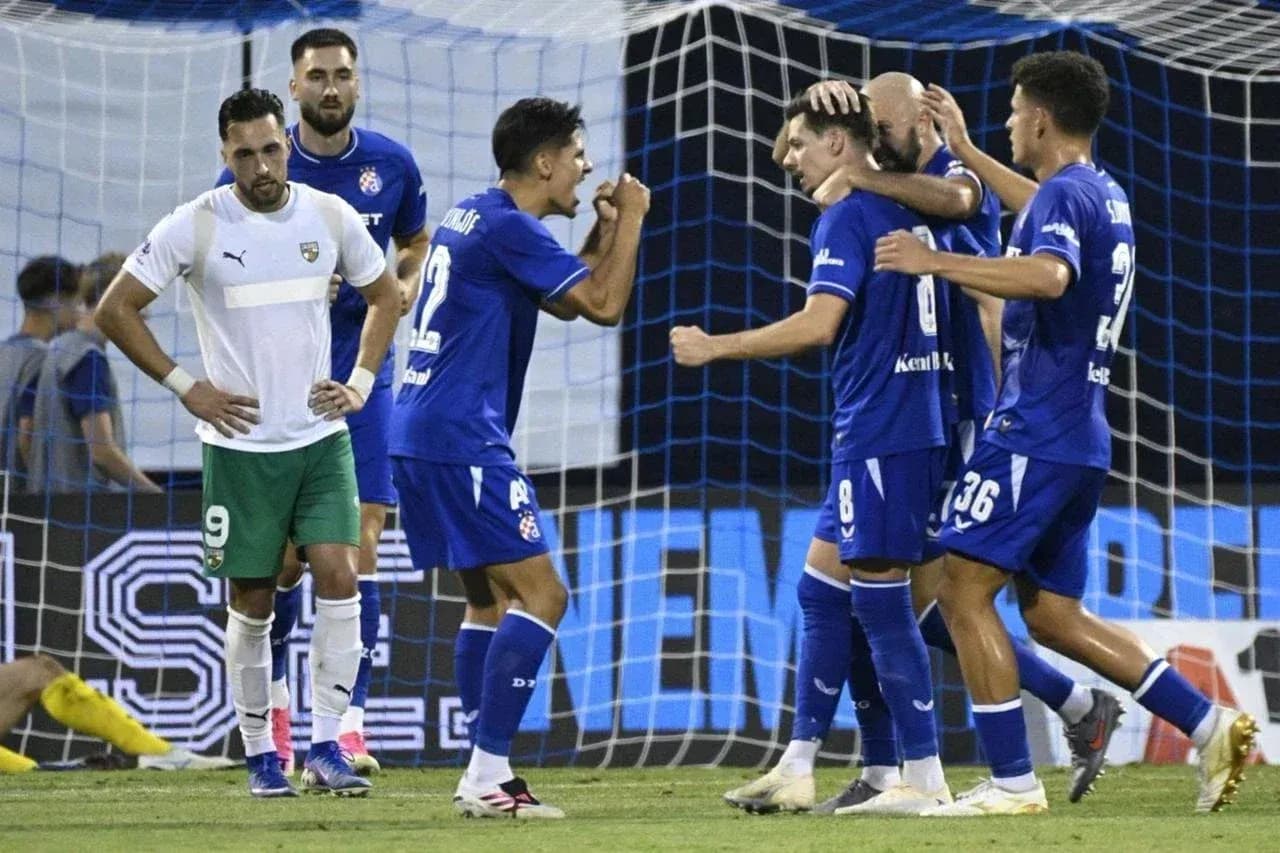 Players celebrating a goal during football match Players celebrating a goal during football match