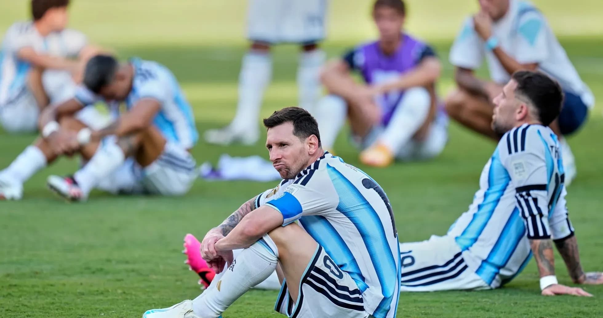 Argentina players seated on the grass after match Argentina players seated on the grass after match