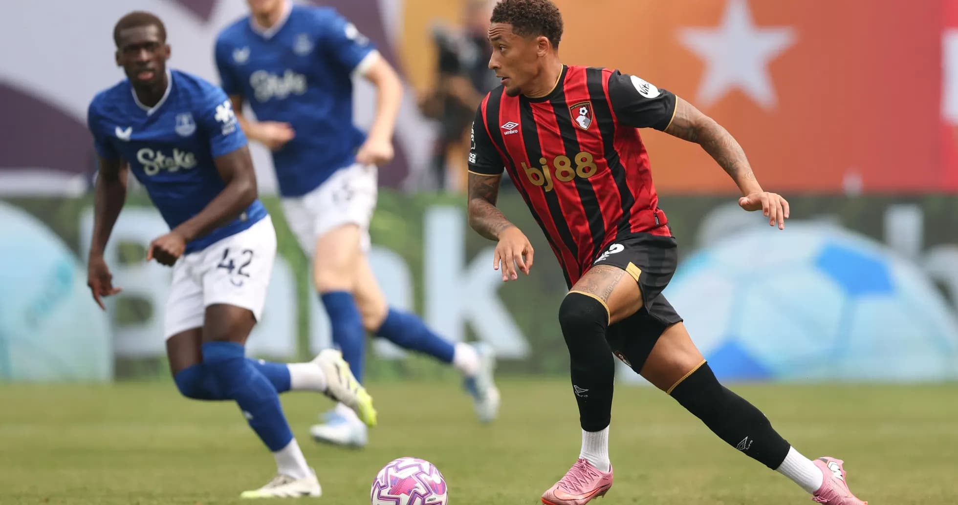 Bournemouth player dribbling the ball in match Bournemouth player dribbling the ball in match