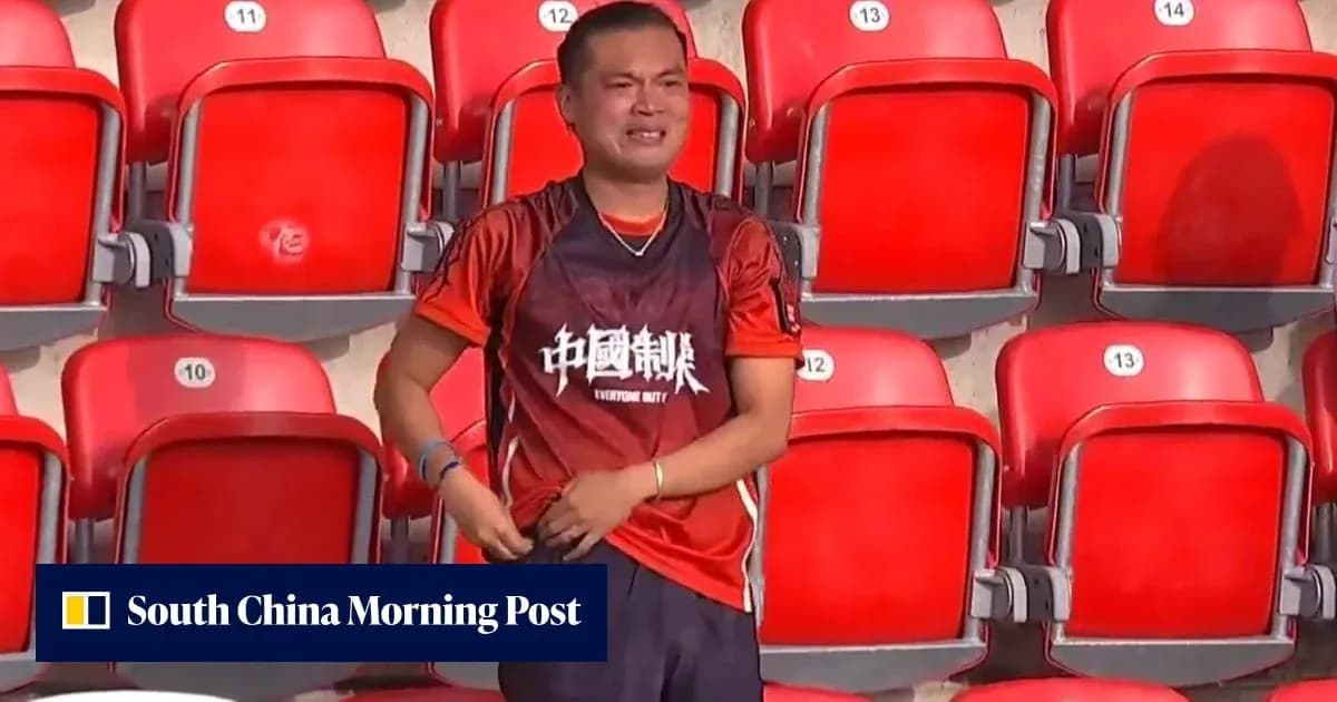 Fan in red shirt celebrating at empty stadium Fan in red shirt celebrating at empty stadium