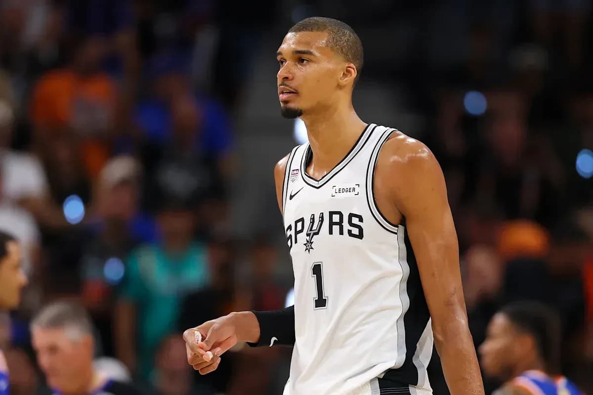 Spurs player on court during basketball game Spurs player on court during basketball game