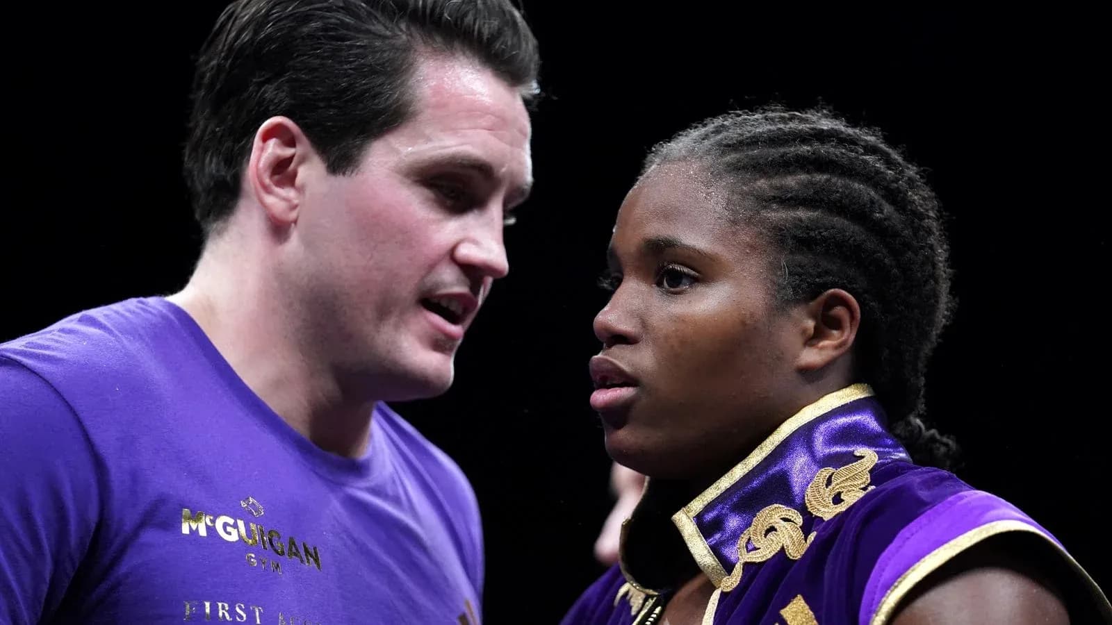 Boxer receiving advice from coach before match Boxer receiving advice from coach before match