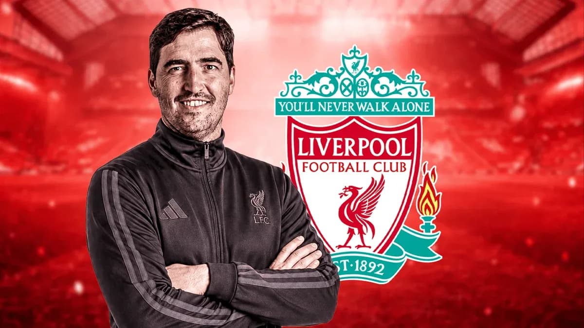 Coach posing with Liverpool FC logo background Coach posing with Liverpool FC logo background
