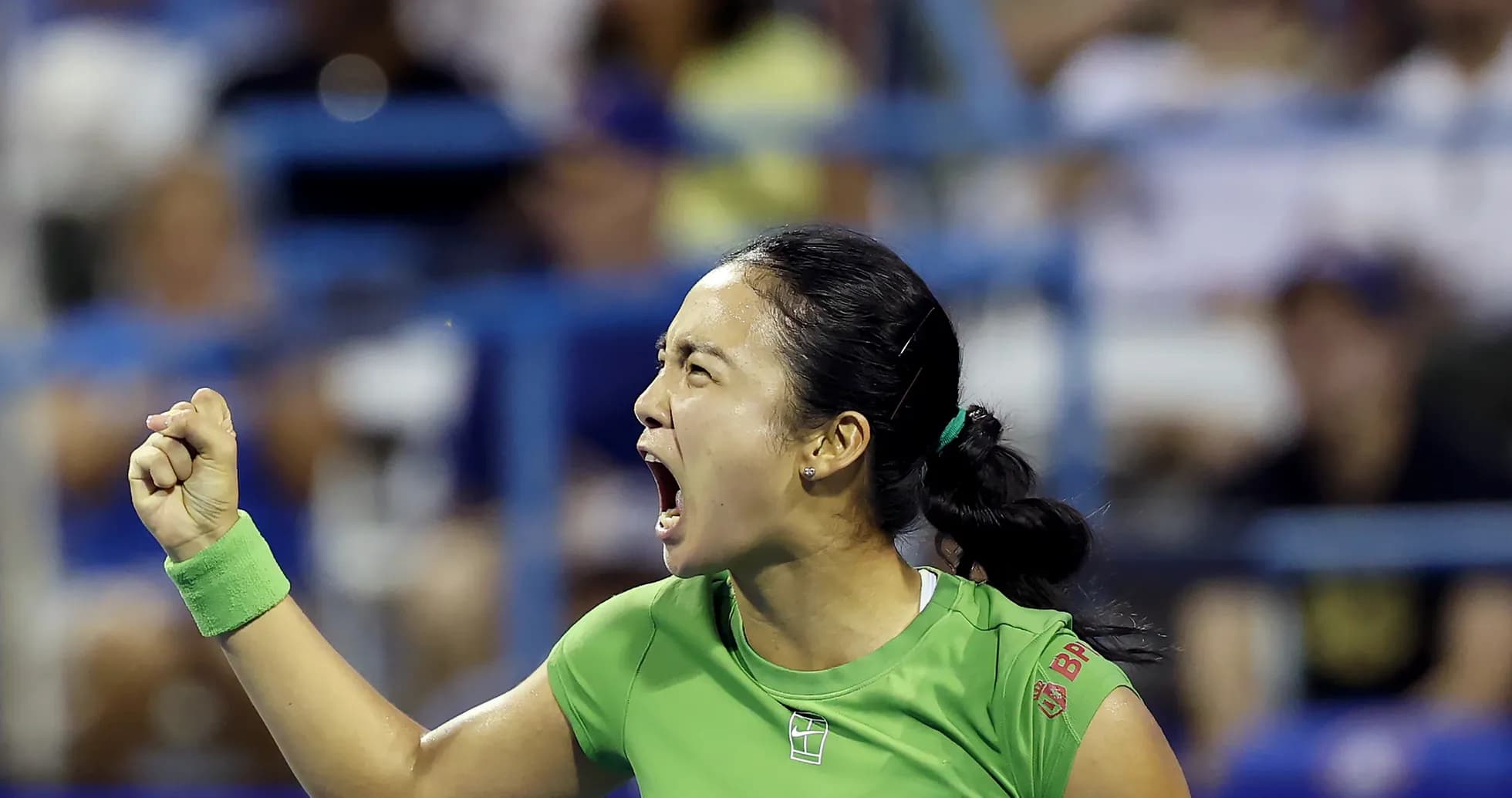 Tennis player celebrating a point during match Tennis player celebrating a point during match