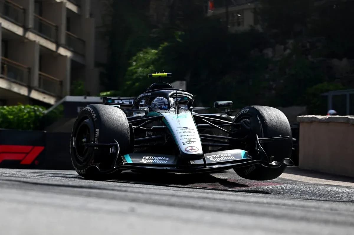 Formula 1 car racing on a street circuit Formula 1 car racing on a street circuit
