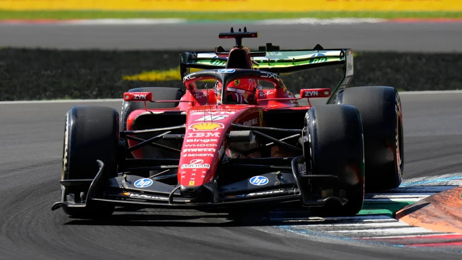 Ferrari Formula 1 car navigating a track corner Ferrari Formula 1 car navigating a track corner