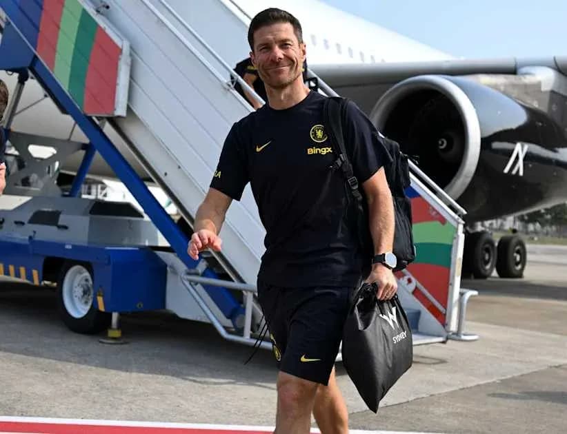Football coach arriving at airport with bag Football coach arriving at airport with bag
