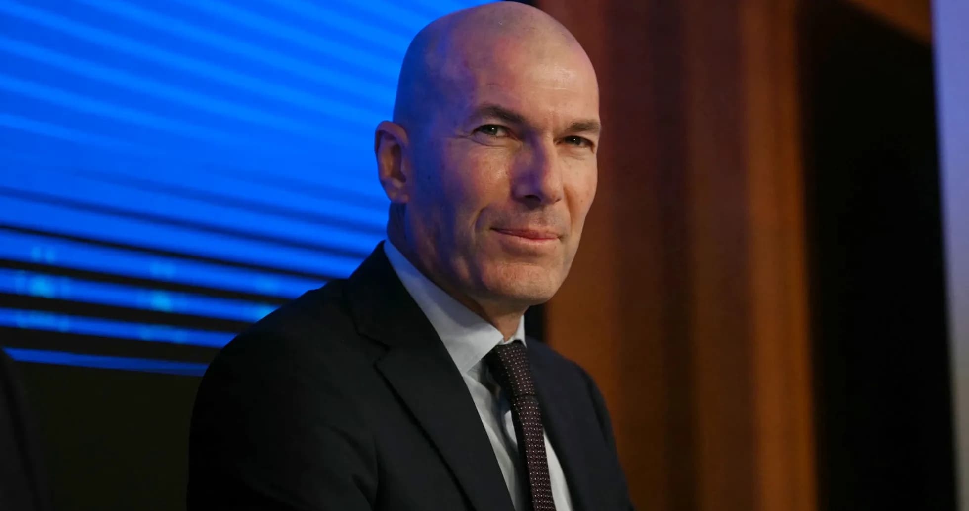 Zidane at press conference with blue background Zidane at press conference with blue background