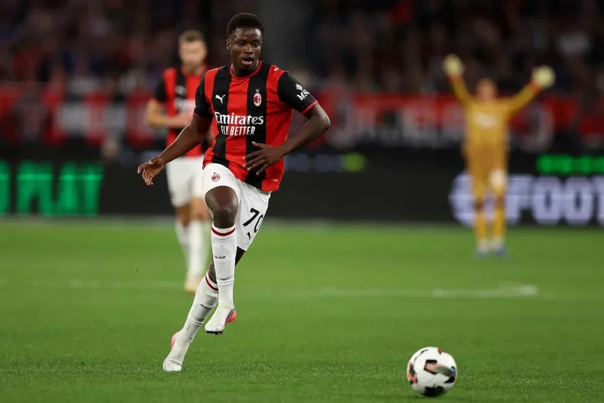 AC Milan player running with ball during match AC Milan player running with ball during match
