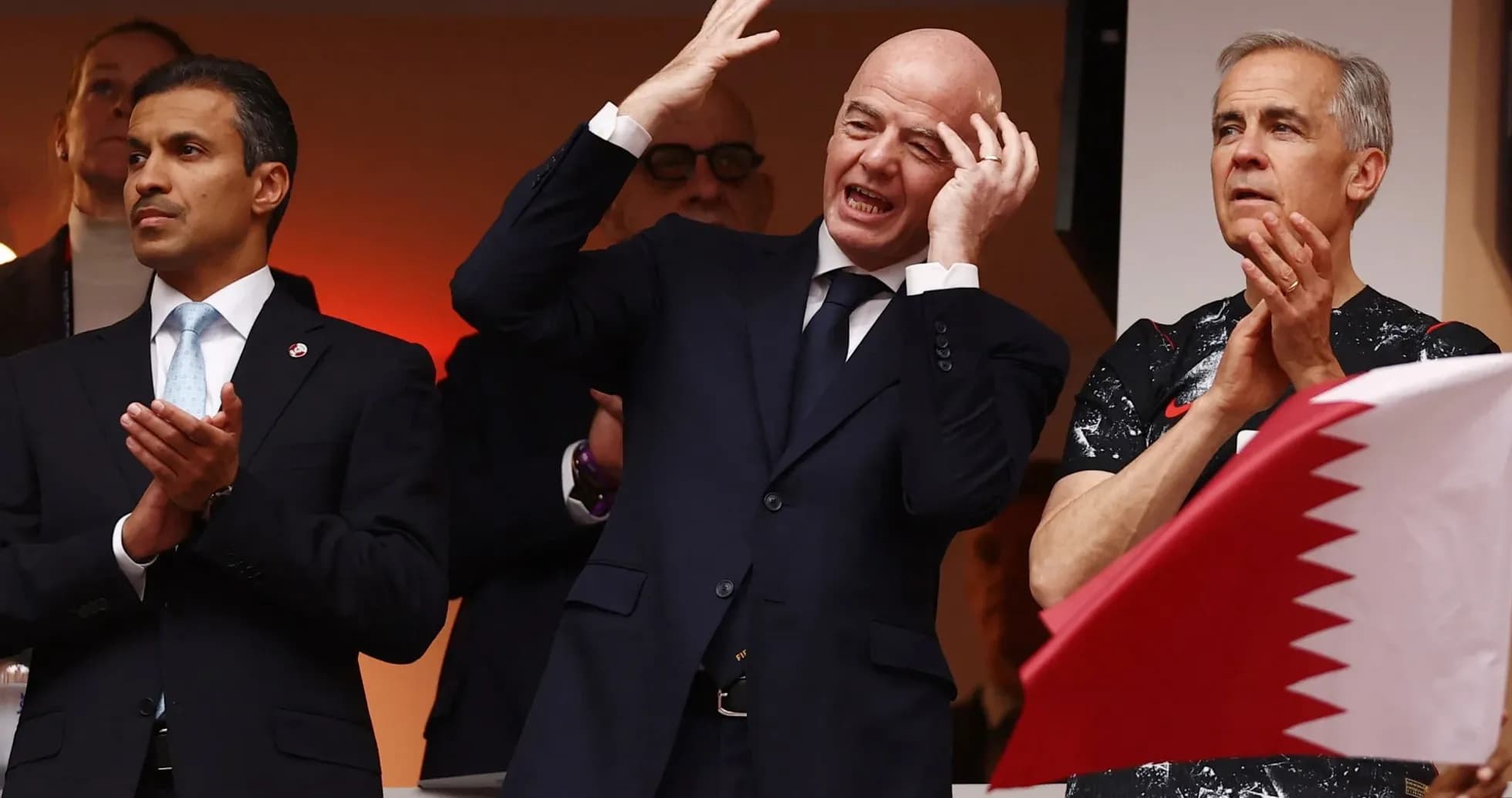 Three officials watching an event, one gesturing excitedly Three officials watching an event, one gesturing excitedly