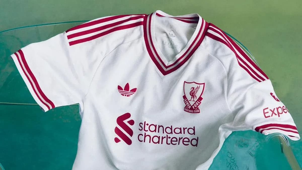 Liverpool FC white jersey with red accents displayed Liverpool FC white jersey with red accents displayed
