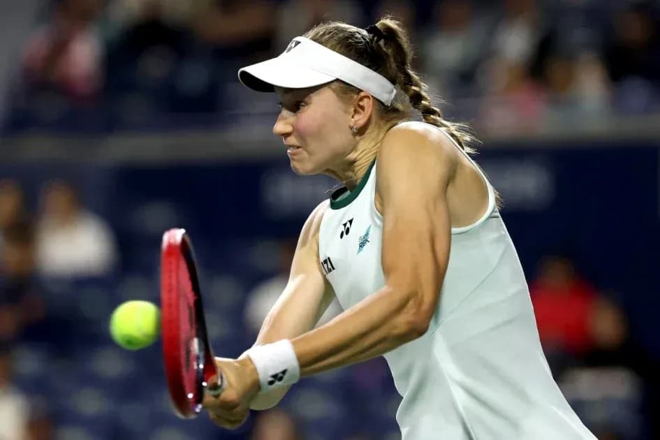 Tennis player hitting a forehand during match Tennis player hitting a forehand during match