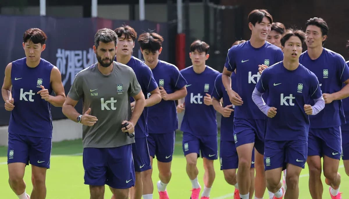 Korea team jogging during training session on field Korea team jogging during training session on field