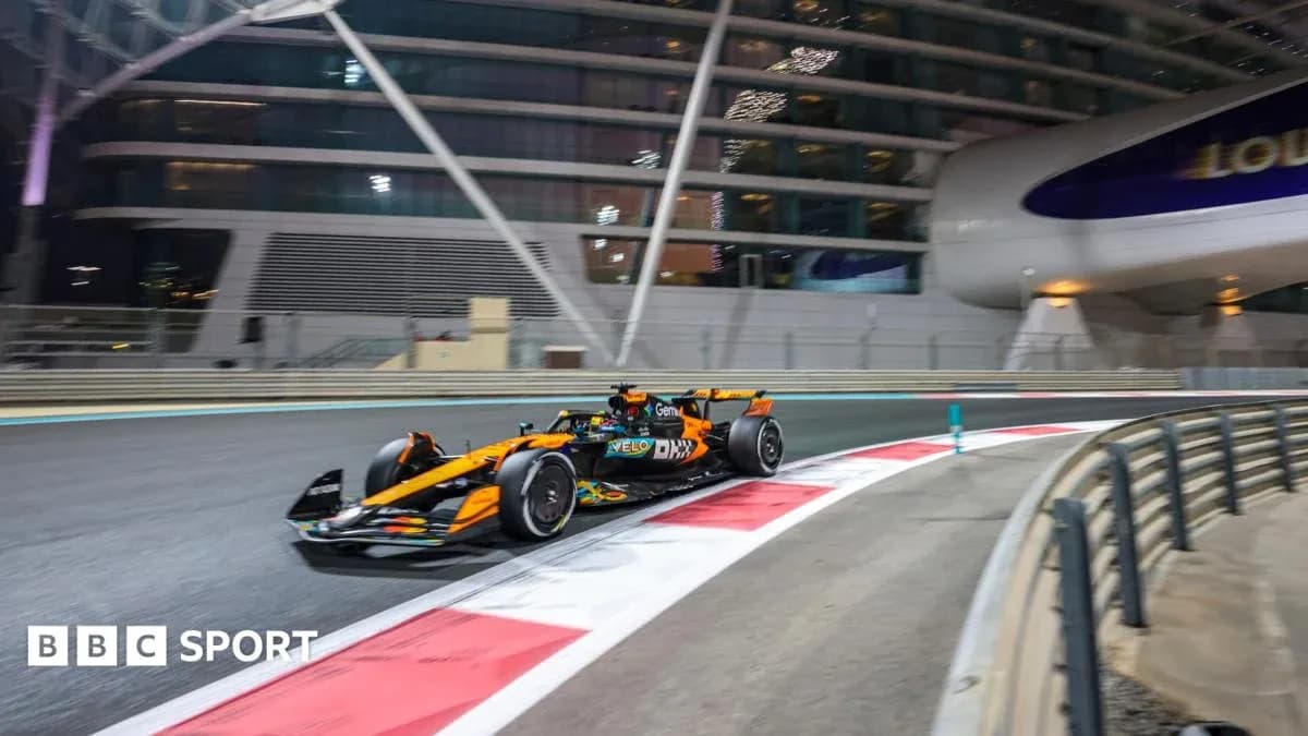 Formula 1 car racing at night on track Formula 1 car racing at night on track