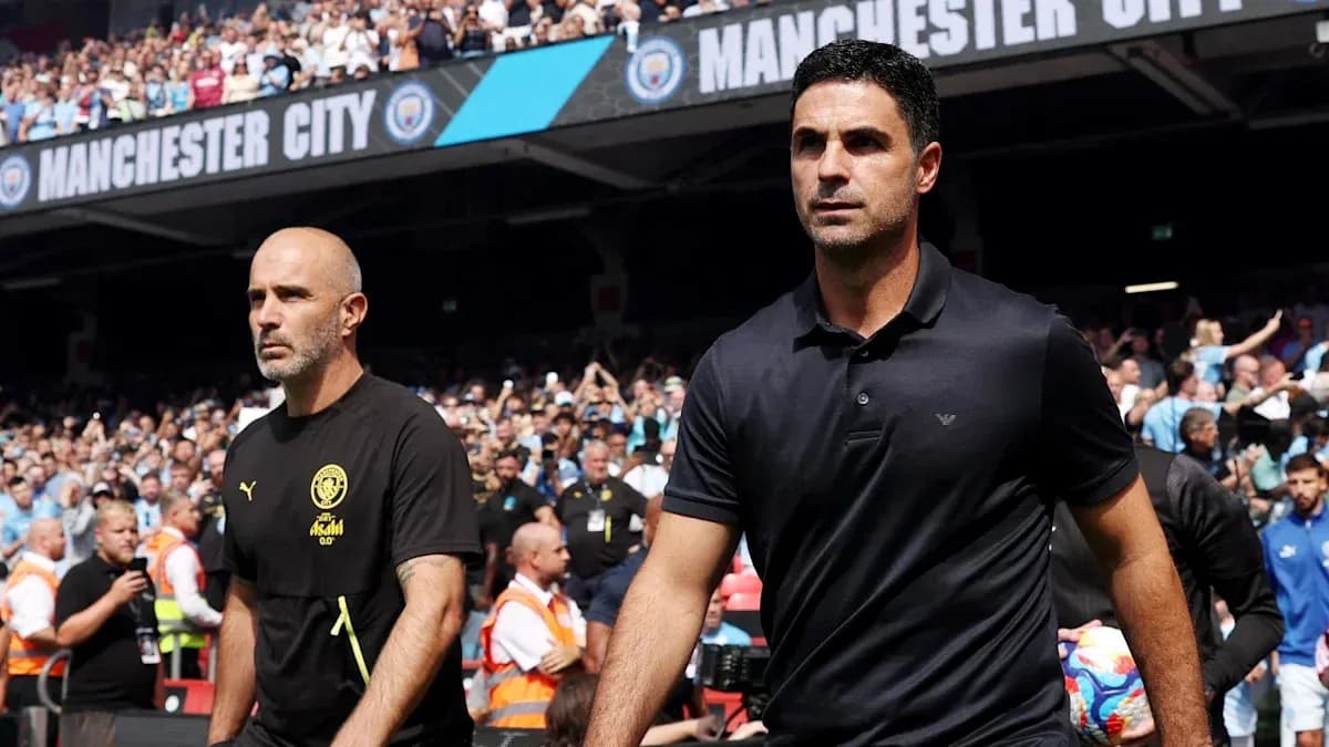 Trainers walking towards the pitch during match Trainers walking towards the pitch during match