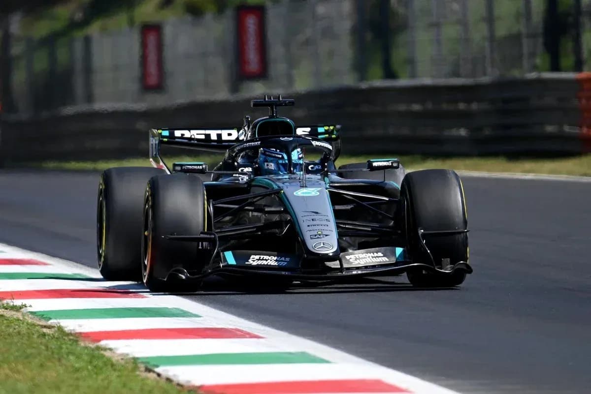 Formula 1 car racing on track with Italian flag colors Formula 1 car racing on track with Italian flag colors