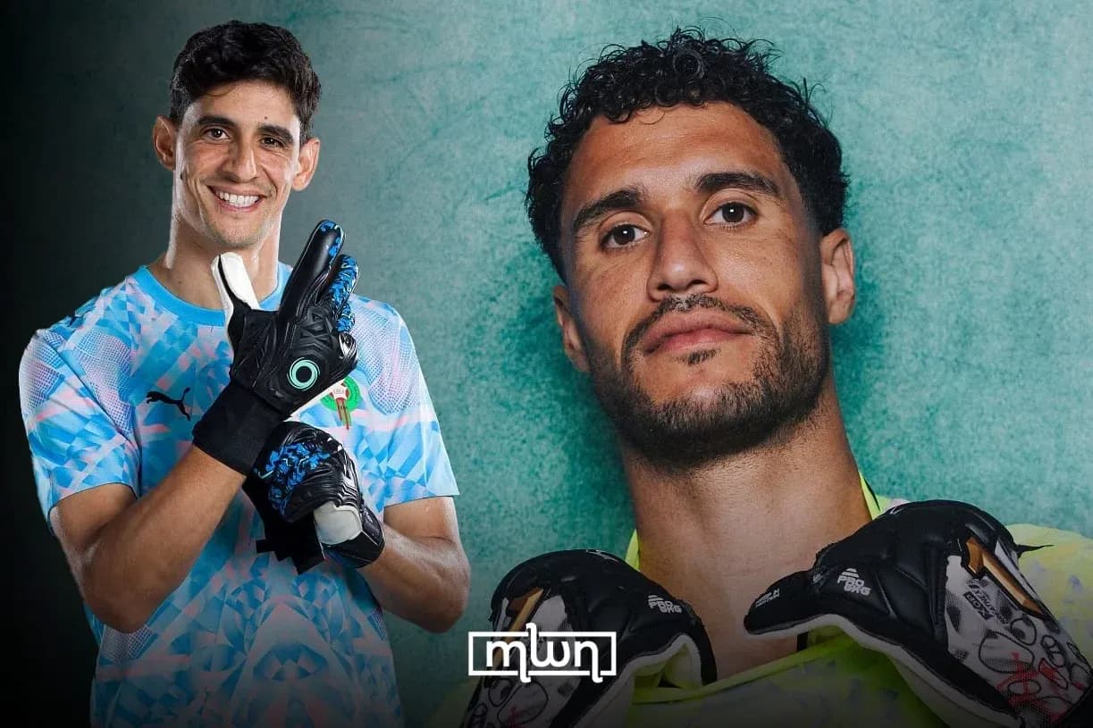 Two goalkeepers posing with gloves and smiles Two goalkeepers posing with gloves and smiles