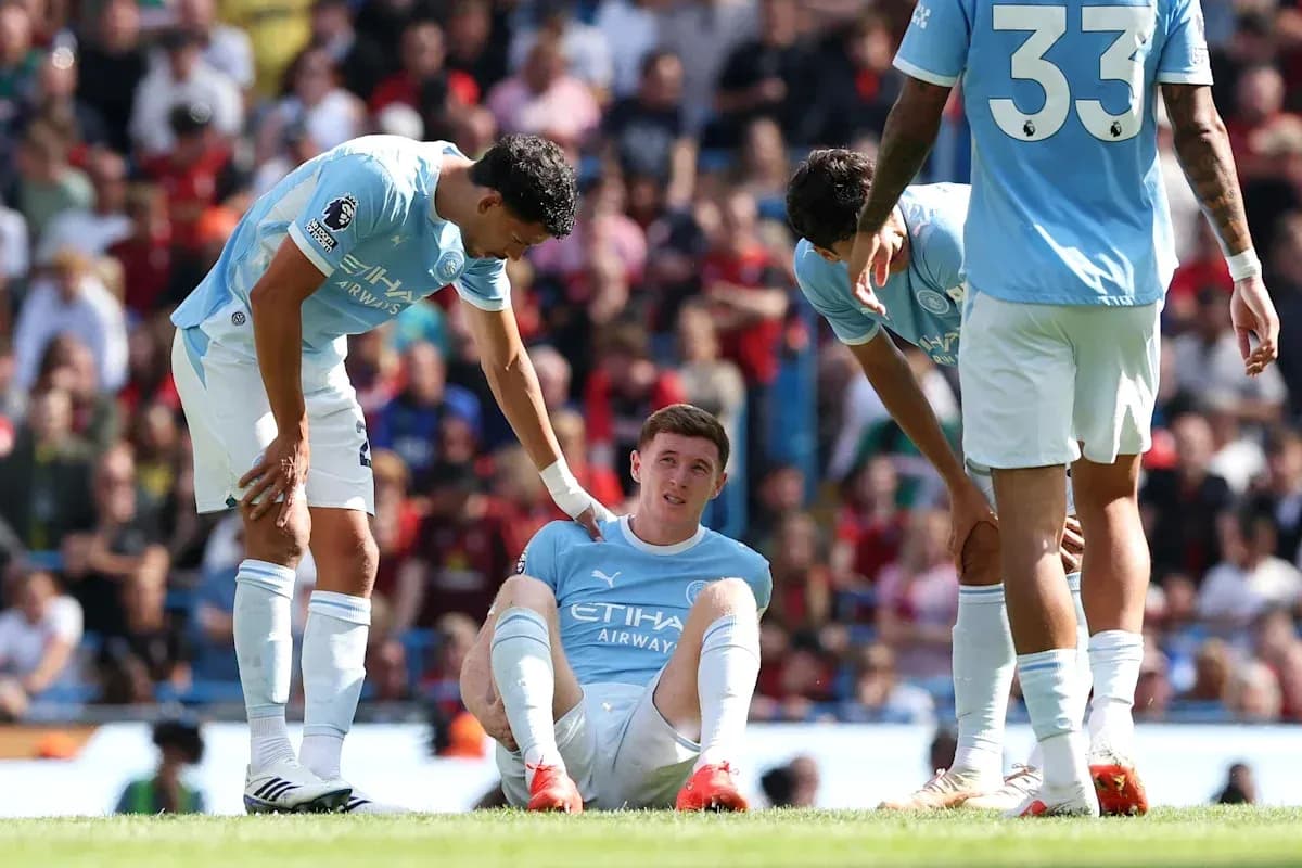 Manchester City players attending to injured teammate Manchester City players attending to injured teammate