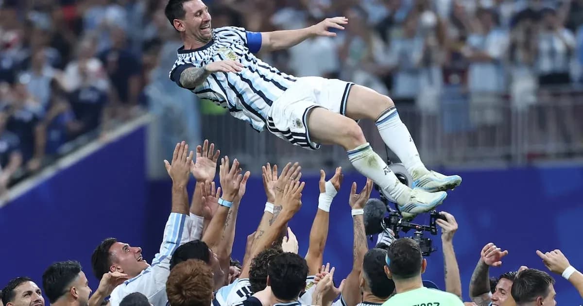 Messi celebrated by teammates after victory Messi celebrated by teammates after victory