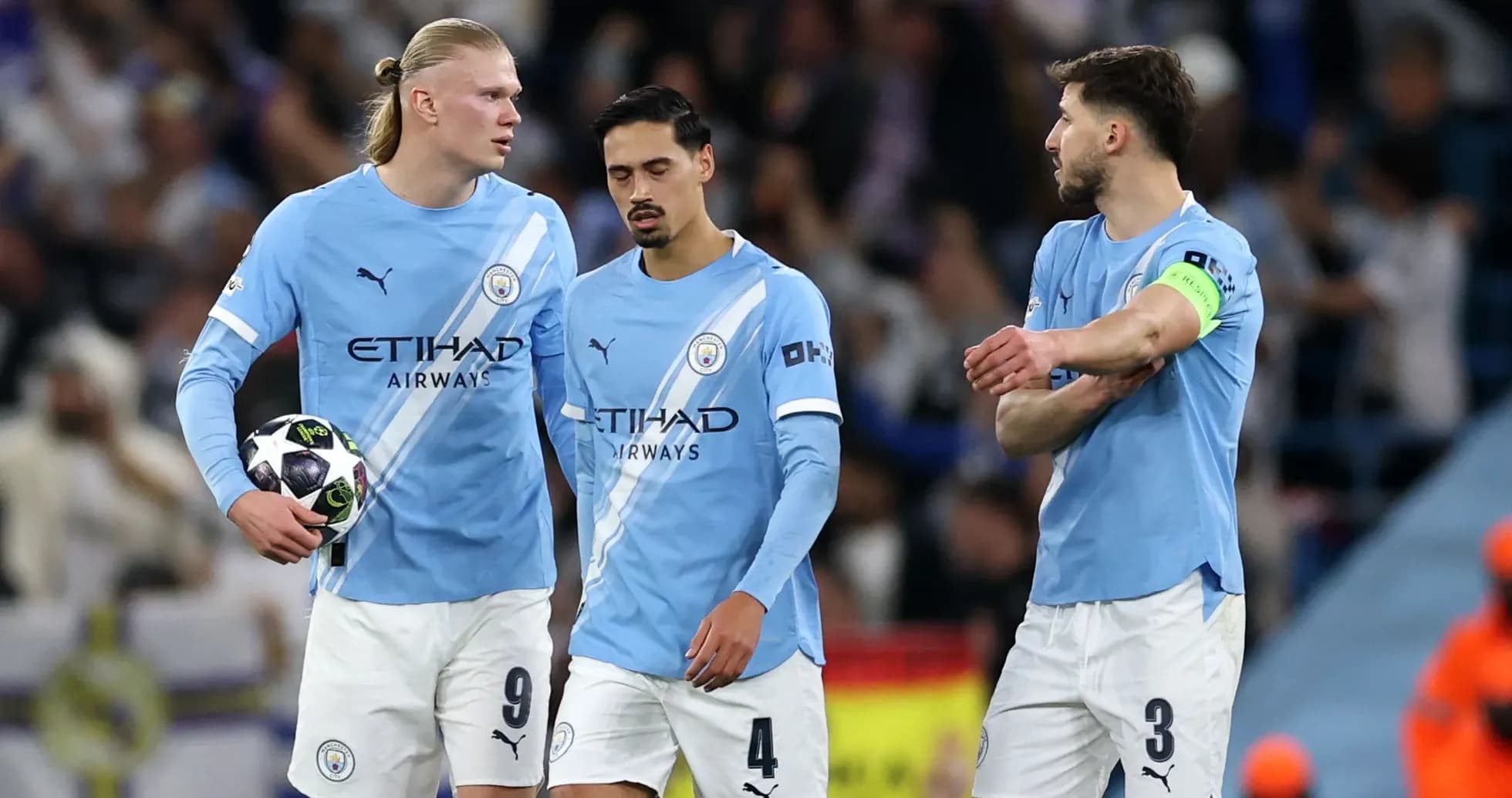 Manchester City players discussing on the pitch Manchester City players discussing on the pitch