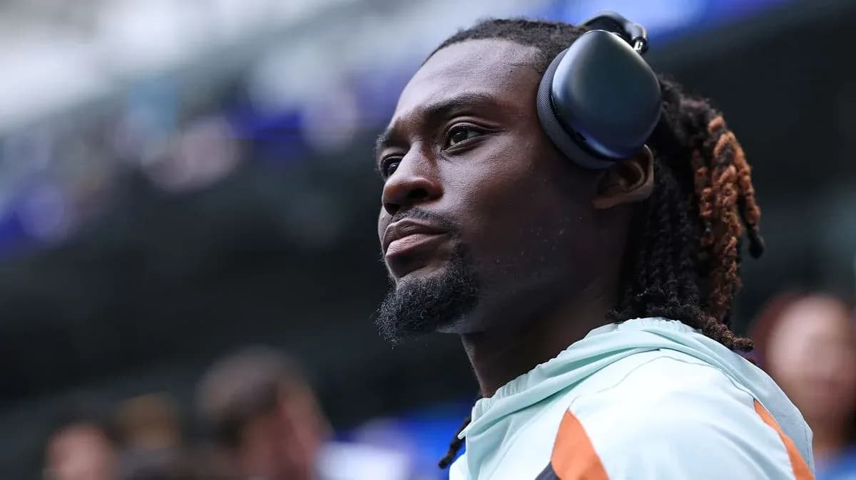 Athlete wearing headphones before the game Athlete wearing headphones before the game