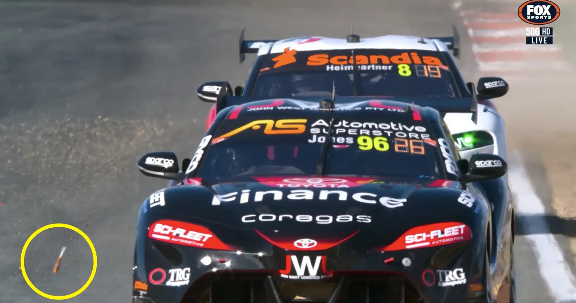 Two race cars competing with debris on track Two race cars competing with debris on track