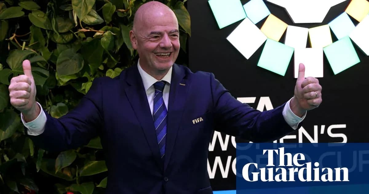FIFA president gesturing thumbs up at event FIFA president gesturing thumbs up at event